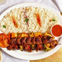 Meat Lovers Combo · A three skewer combination of chicken kabob, lamb kabob and kobideh kabob. Served with a gri...