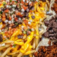 El Jefe Box · Our pizza box filled with jefe nachos, asada fries, and 3 street tacos with cilantro and oni...