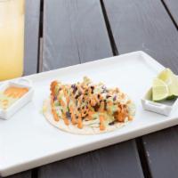 Fish Taco · Beer battered cod in a corn tortilla, topped with our slaw and choice of chipotle aioli or c...