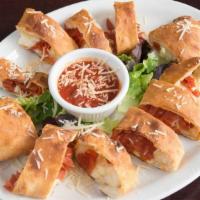 Pepperoni Rolls · Pepperoni, mozzarella, parmesan cheese rolled up in strips of our famous pizza dough, and ba...