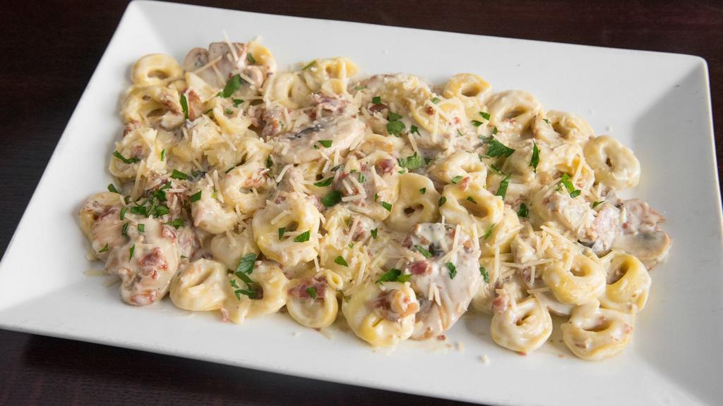 Soprano'S Special Pasta · Cheese filled tortellini, bacon, mushrooms, homemade alfredo sauce, and parmesan. Served with garlic bread.