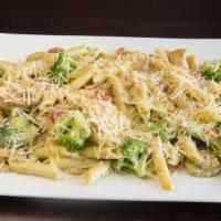 Penne Pollo E Broccoli Pasta · Penne pasta, chicken, broccoli, roasted red pepper, mushrooms, and creamy pesto sauce.  Serv...