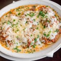 Baked Ravioli Pasta · Meat stuffed pasta covered with bolognese sauce, mozzarella, and parmesan.