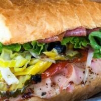 Spicy Italian Sandwich · Boars Head Brand ham, salami and hot cappy with provolone, topped with lettuce, tomato, onio...
