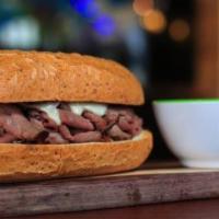 French Dip Sandwich · Boars Head Brand Roast beef with Swiss cheese and horseradish sauce, toasted on a sub roll s...