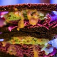 Corned Beef Reuben On Dark Rye Sandwich · Double toasted with boars head brand corned beef and swiss cheese, thousand islands, light h...