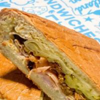 Cubano · Smoked Pork, Ham, Swiss Cheese and pickles with a spicy mayo and spicy brown mustard on a wh...