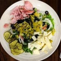 The Italian Salad · Fresh green leaf lettuce with tomato, onion, sliced black olives, pepperocinis, dill pickle ...