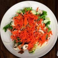 Classic Veggie Salad · Fresh green leaf lettuce piled high with tomato, onion, cucumbers, bell peppers, mushrooms, ...