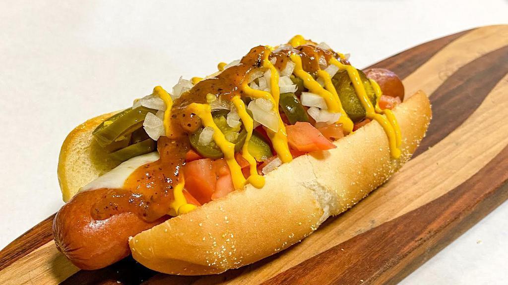 The Chihuahua · Your choice of dog with Yellow Mustard, Pepper jack Cheese, Jalapenos, Tomato, Onion and Habanero Hot Sauce.  Toasted