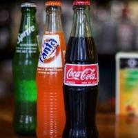 Mexican Coke Products · 12 ounces bottles of mexican coke, sprite and orange fanta.