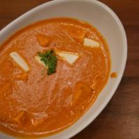 Paneer Makhni-D · Gluten free. Indian-style cheese cubes simmered in a tomato. Onion, and cream-based sauce.