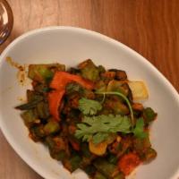 Khatta Bhindi-D · Vegan and Gluten Free. Chopped okra with fresh bell peppers, onions, and dried mango powder.