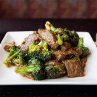 Beef With Broccoli · Sliced flank steak stir-fried with broccoli, and water chestnuts in our house brown sauce.