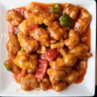 Sweet And Sour Pork · Sliced pork loin deep-fried and wok tossed in our sweet and sour sauce with pineapple and gr...