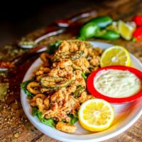 Calamari Don Juan · Tender calamari lightly breaded and fried until golden brown then tossed with jalapeño peppe...