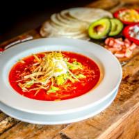 Chicken Tortilla Soup · Gluten-free. Tender shredded chicken in a rich tomato broth. Topped with corn tortilla strip...