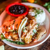 Baja Fish Tacos · Two soft flour tortillas filled with plump beer battered white fish, cabbage, and pico de ga...
