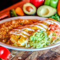 Carne Asada Burrito · A flour tortilla filled with outside skirt meat, pico de gallo and whole beans. Smothered wi...