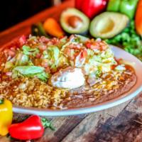 Big Bertha Burrito · A large flour tortilla stuffed with black beans, shredded mixed cheese, Mexican rice and you...
