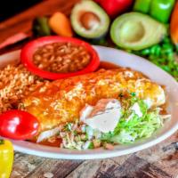 Fiesta Fajita Burrito · A flour tortilla filled with your choice of grilled chicken or steak with onions, mixed shre...