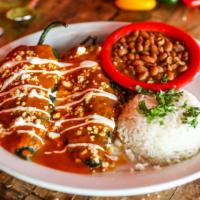 Dos Chiles · Gluten-free. Mild poblano chiles stuffed with Jack cheese, shredded chicken, smothered with ...