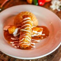 Crispy Chile Relleno · Anaheim chile wrapped with a wonton paper, stuffed with Jack cheese. Served with ranchera sa...
