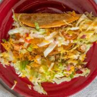 Taco · Choice of mixed cheese, shredded chicken, ground beef or shredded beef.