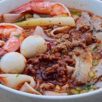 Special Kasoy · Fresh wide noodles in a savory bone broth, topped with minced pork sauce made with fermented...