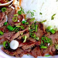 Waterfall Beef · Grilled marinated steak served w/jasmine rice and a side of jeow som dipping sauce.
