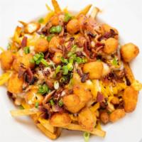 Poutine · homestyle fries, cheese curds, cheddar & jack cheese, brown gravy, bacon, green onion