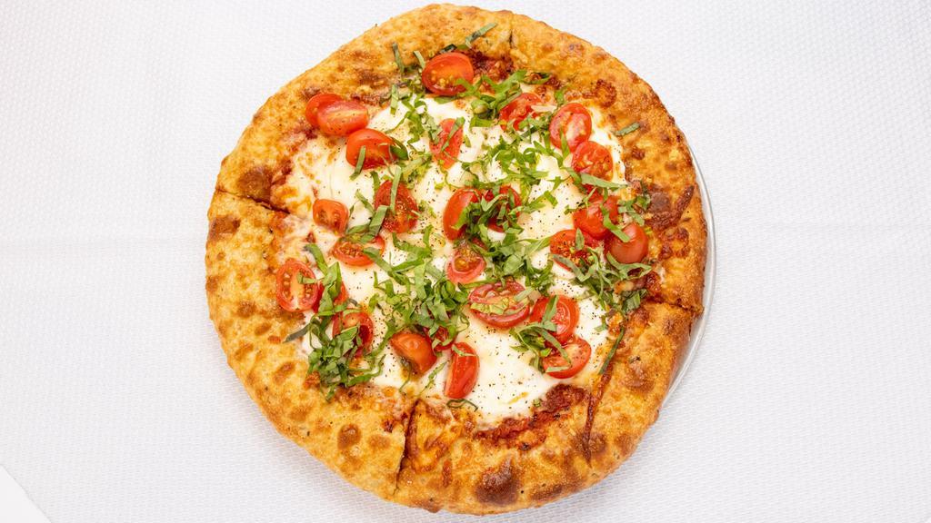 Margherita Pizza · Marinara, fresh mozzarella, basil, tomato.