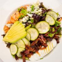 Cobb Salad · Hard egg, avocado, bacon, blue cheese crumbles, tomato, pickled cucumbers, ranch dressing.