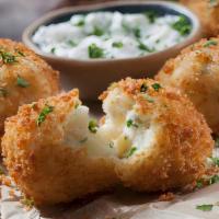 Deep Fried Potato Round · House cut round potatoes coated in batter than deep fried!
