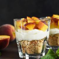 Peach Cheesecake Parfait · Peanut butter crusted cheesecake with some munchie flavored peach topping!
