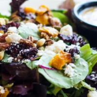 Harvest Salad · Roasted butternut squash, beets, pumpkin seeds, pecans, feta cheese, and greens tossed in a ...