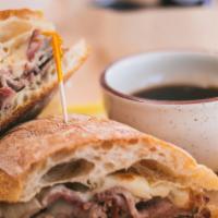 Market Dip · Smoked tri-tip or brisket topped with cheese and grilled onions served on a ciabatta bun wit...