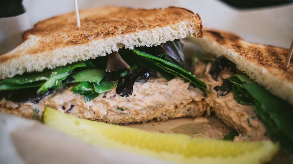 Tuna Sandwich · White tuna, celery, onion, pickle and lemon zest aioli served on spring mix and choice of bread.