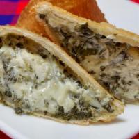 Spinach Artichoke Dip Samosa · Pastry filled with fresh spinach, marinated artichokes, and smoked cheese and fried until go...
