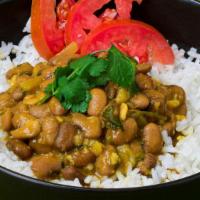 Spicy Coconut Beans (Maharagwe) · Fresh beans slow simmered in a spicy tomato coconut sauce.