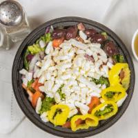 Greek Salad · Romaine lettuce, diced onions, diced tomatoes, feta cheese, Greek olives and banana peppers ...