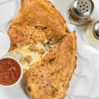 Calzone · Hand tossed dough with Mozzarella cheese and our own ricotta cheese blend. Served with ranch...