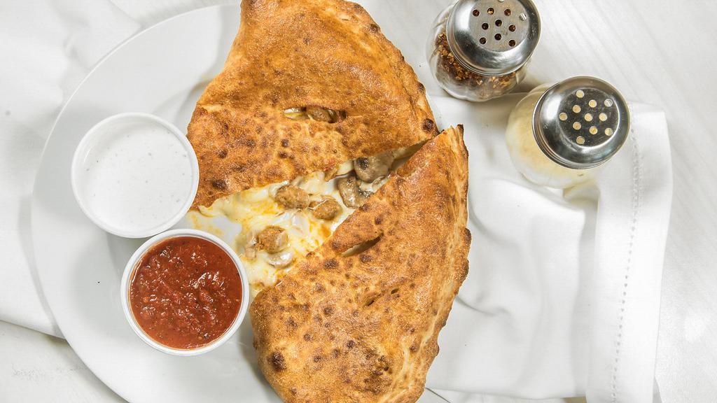 Calzone · Hand tossed dough with Mozzarella cheese and our own ricotta cheese blend. Served with ranch and marinara sauce.