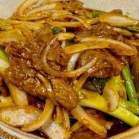 Mongolian Chicken Or Beef · Chicken or Beef sautéed in a sweet and semi-spicy brown sauce mixed with white and green oni...