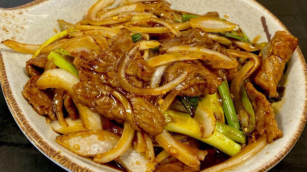 Mongolian Chicken Or Beef · Chicken or Beef sautéed in a sweet and semi-spicy brown sauce mixed with white and green onions