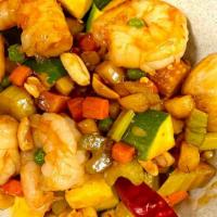 Kung Pao Shrimp · Spicy.  Diced vegetables and peanuts sautéed with Shrimp in hot garlic sauce.
