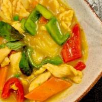 Yellow Curry Chicken Or Beef · Spicy. Green & red bell pepper, peas and carrots, bamboo and basil in yellow curry sauce wit...