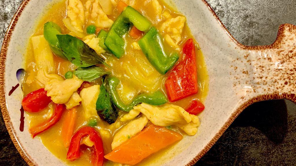 Yellow Curry Chicken Or Beef · Spicy. Green & red bell pepper, peas and carrots, bamboo and basil in yellow curry sauce with Chicken or Beef.