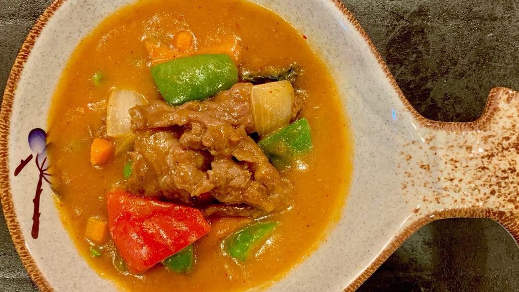Panang Red Curry Chicken Or Beef · Spicy.Green & red bell pepper, peas and carrots, bamboo and basil in red curry sauce with Chicken or Beef.