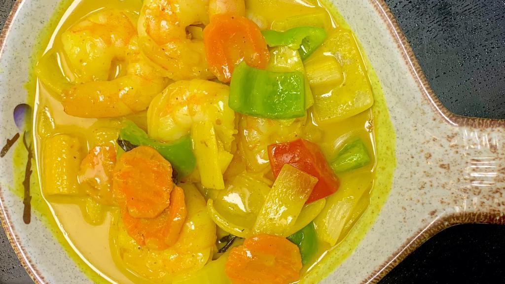 Yellow Curry With Shrimp · Spicy.Green & red bell pepper, peas and carrots, bamboo and basil in yellow curry sauce with Shrimp.